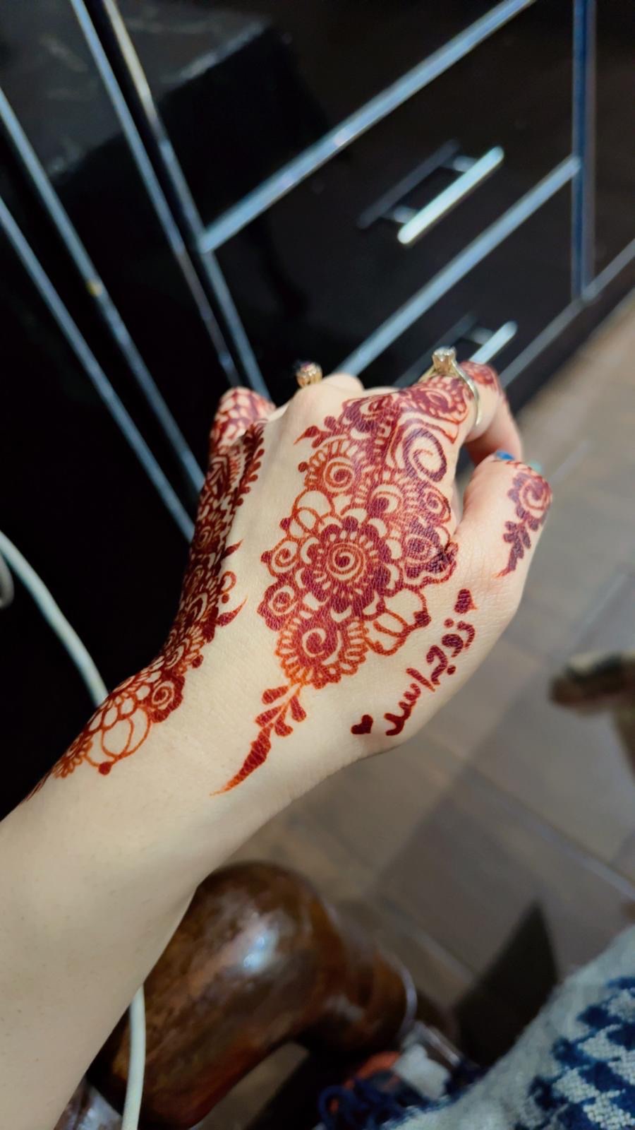 Floral henna design back of hand